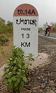 Kilometerstone near Pakse by Asienreisender